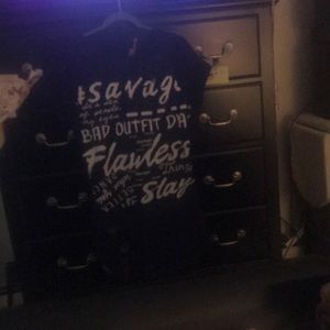 A bluer dress , with white lettering, size Medium.